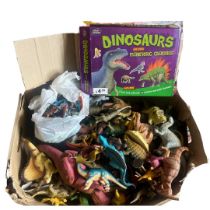 A collection of collectable quality dinosaur figures alongside a large quantity 80s-00s McDonalds