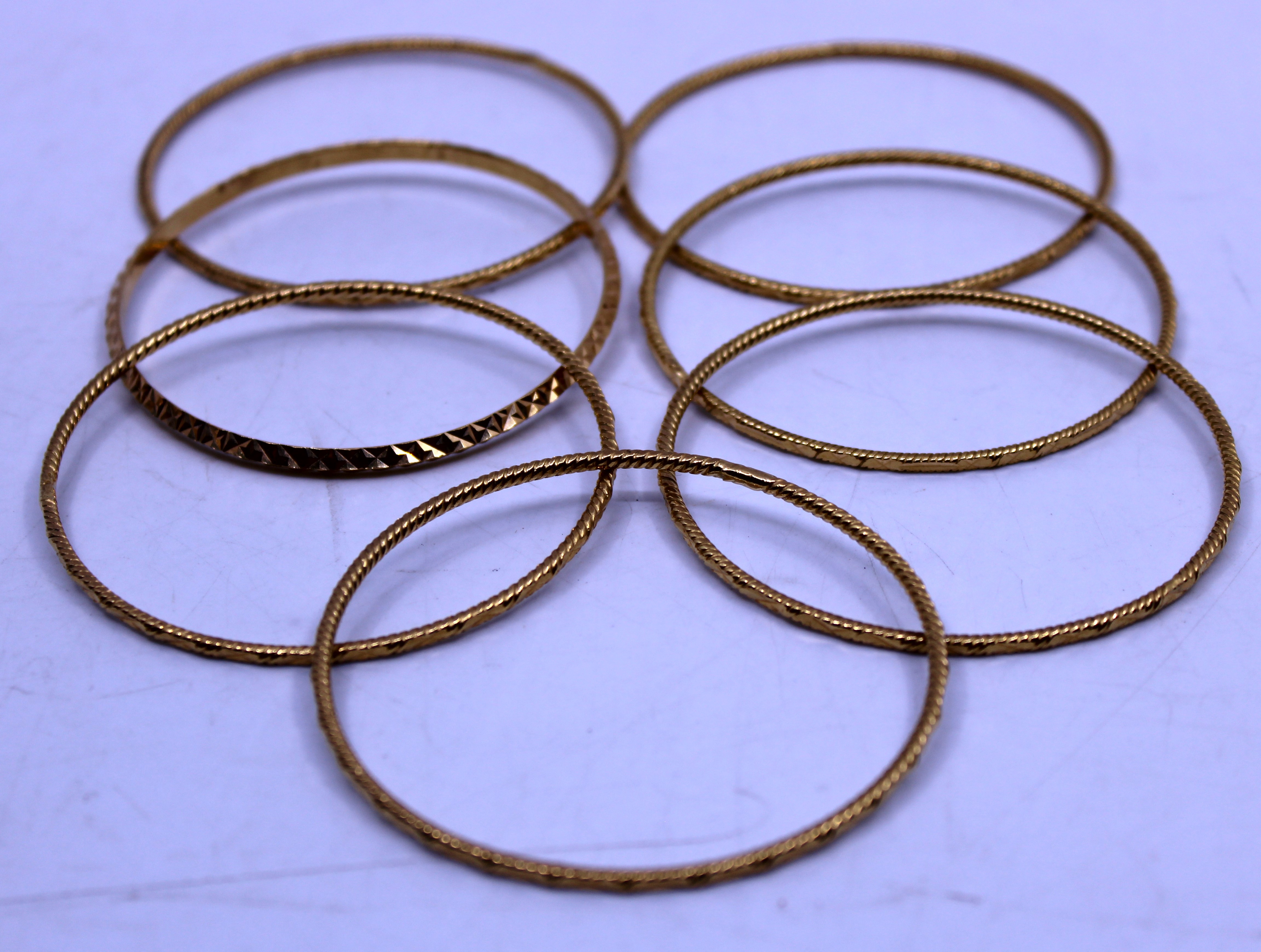 Selection of Seven Unmarked Yellow Metal Patterned Bangles. Total weight is approx. 73.75g. - Image 2 of 2