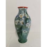 A Royal Doulton pottery glazed and hand painted vase depicting flowers, 29cm high. (1)