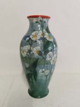 A Royal Doulton pottery glazed and hand painted vase depicting flowers, 29cm high. (1)
