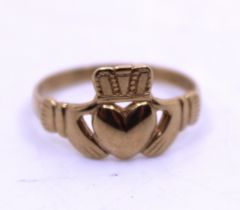 9ct Yellow Gold Claddagh Ring.  Ring Size P 1/2.  Total weight of the ring is approx. 2.3 grams.