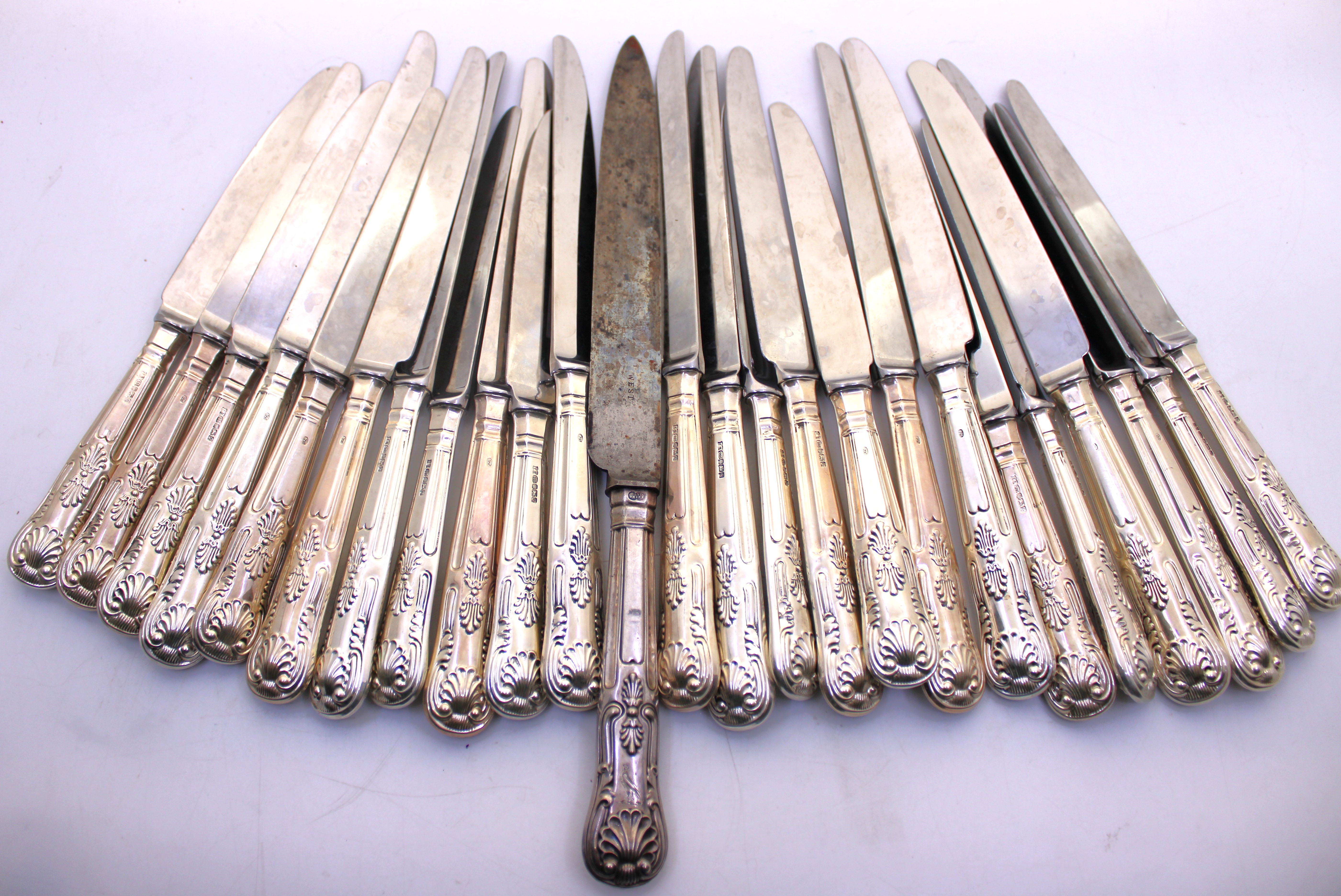Twenty Four Sterling Silver Weighted Handled Knives. There is a Knife that is hallmarked on the