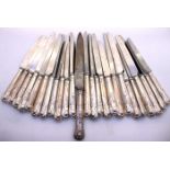 Twenty Four Sterling Silver Weighted Handled Knives. There is a Knife that is hallmarked on the