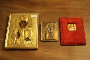 A Russian orthodox church icon of St. Nicholas overlaid with a repousse gilt brass rizla, 17.5cm x