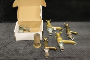 Two pairs of early 20th century brass taps