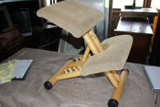 Wooden framed ergonomic kneeling stool with adjustable height (STOKKE Brand)