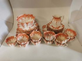 An Orange and white Victorian china tea set by Foley China, RD 115510 with a fluted body. 11 trios