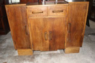Heavy oak 1940's sideboard with 2 x Top Draws 1 double central and 2 side cupboards.