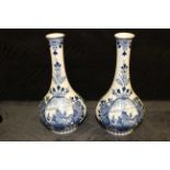 A pair of blue and white Delft baluster vases in 19th century style, printed marks, 26cm high