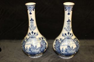 A pair of blue and white Delft baluster vases in 19th century style, printed marks, 26cm high