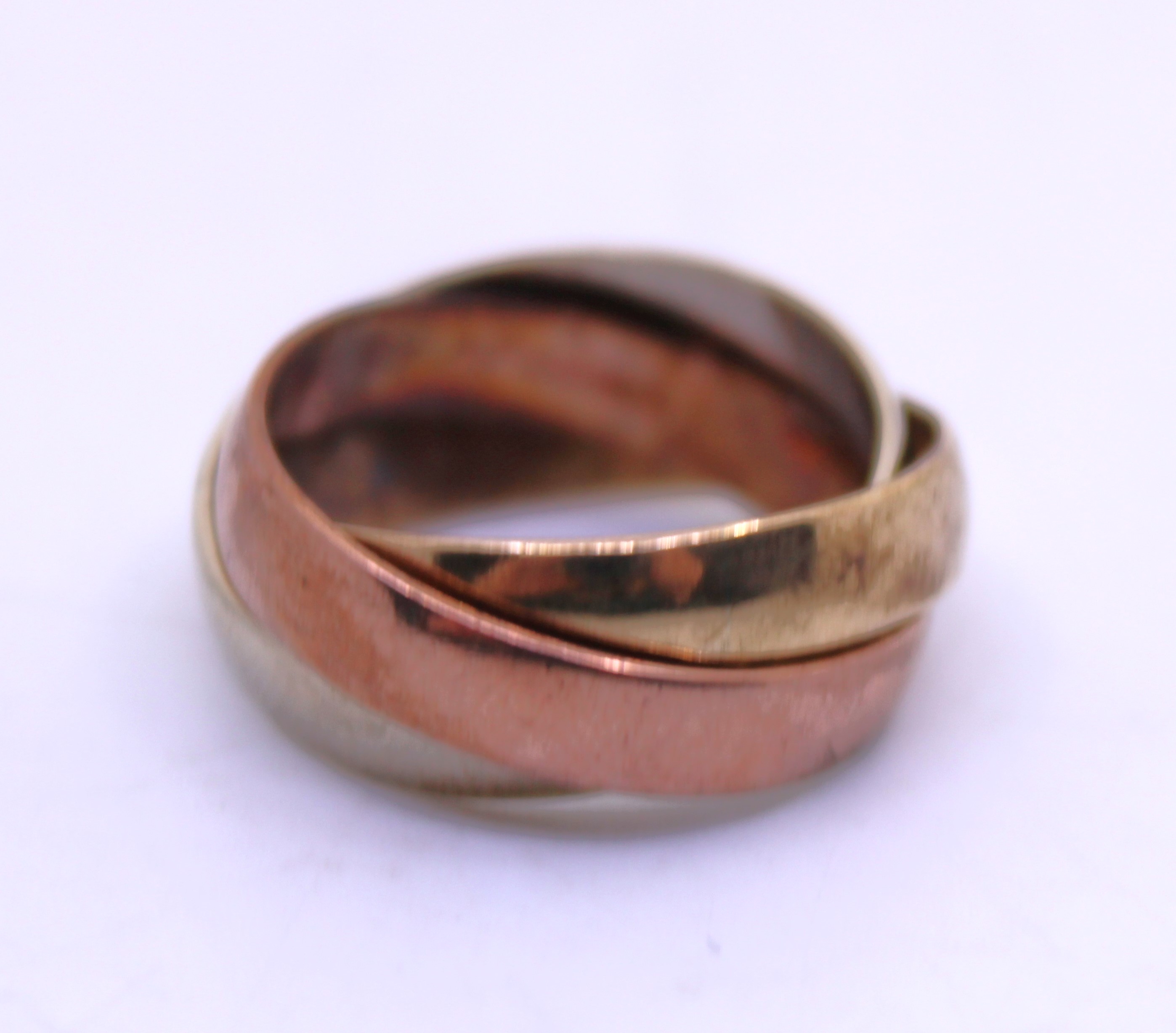 Tri-Coloured 9ct Gold Puzzle Ring.  Consists of a 9ct Rose Gold Band, 9ct Yellow Gold Band and 9ct