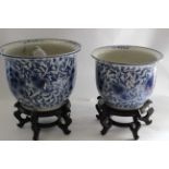 Two Chinese Hand painted Blue and White porcelain Jardinière and stand. Circa 1900.