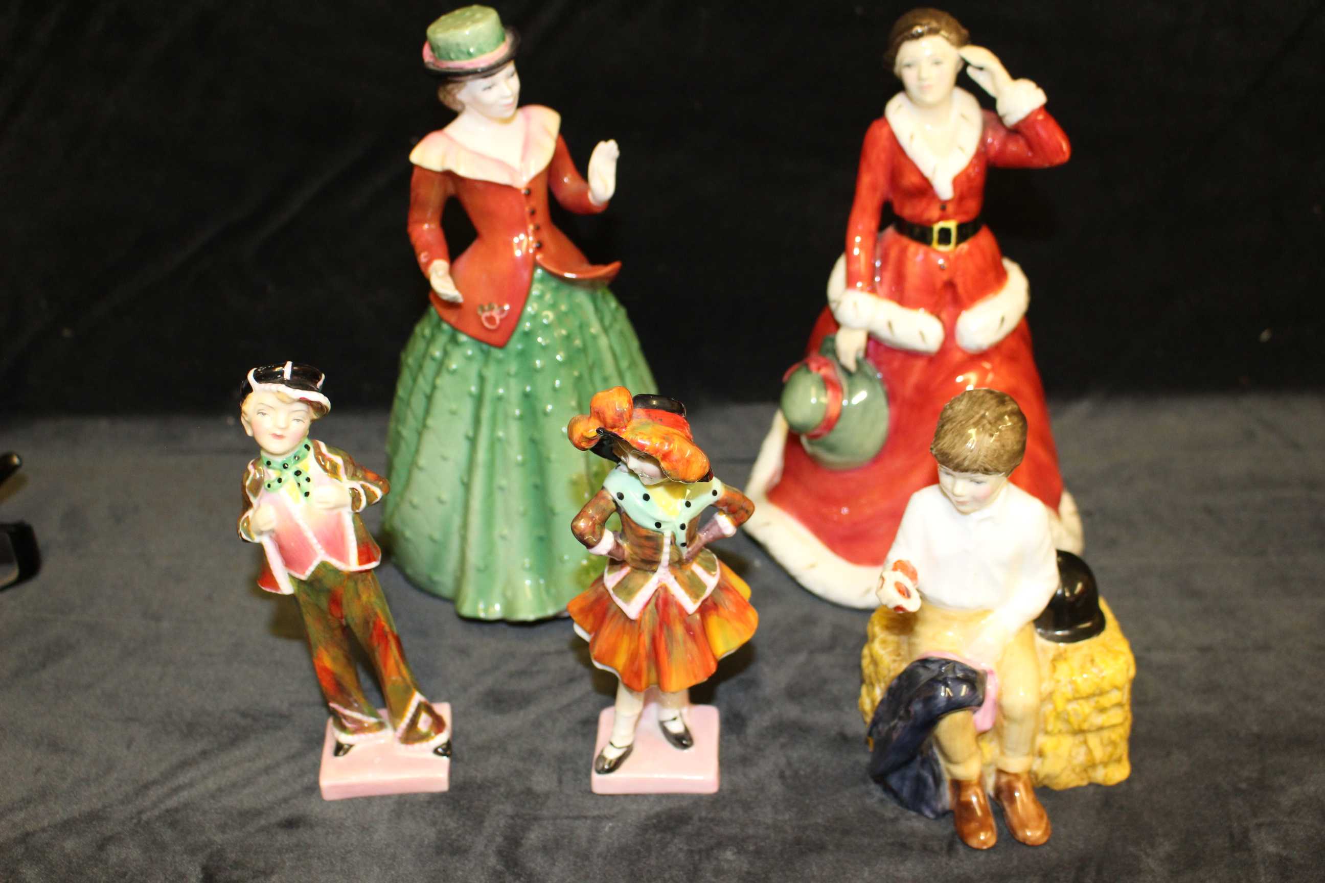 A Royal Doulton figure "Holly" HN 3647, "Winter's Day" HN 3769, "First Prize" HN 2911, "Pearly