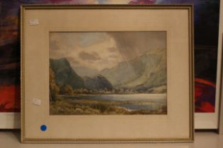 A watercolour of a mountain lake scene by J Gresley. Frame: 55cm by 44cm. (1)