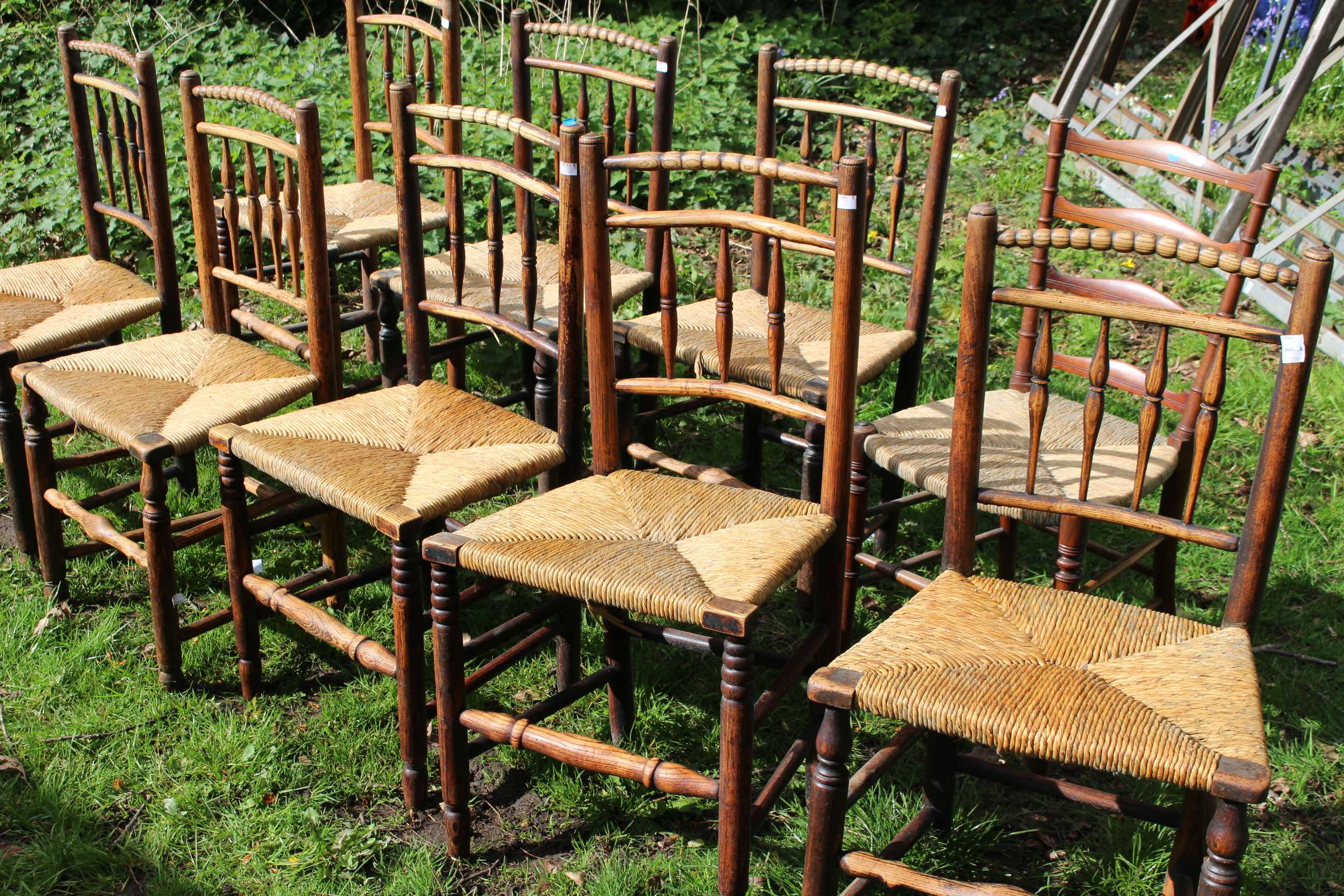Nine c1900 Rush seated mostly spindle back chairs. (9)