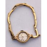 Ladies Vintage 9ct Gold Cyma Watch with 9ct Gold Stretchable Bracelet.  The back of the 9ct Gold