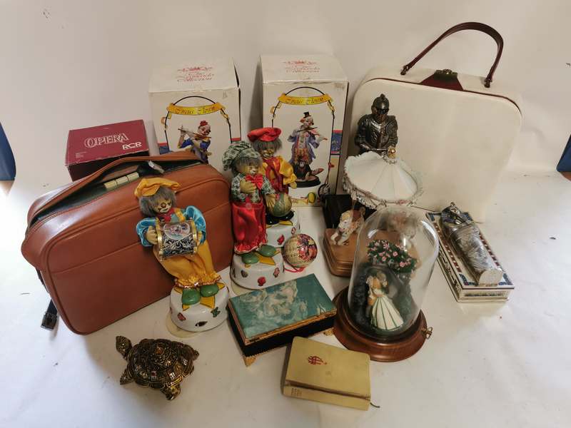 4 boxes of miscellaneous items to include; figure of boy playing drums, musical clowns, toy cars,