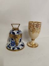 A blue and white pottery Taylor Tunnicliffe bell form biscuit barrel with brass mounts and hinged