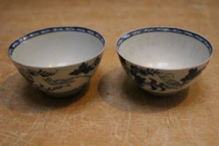 A near pair of 18th century Liverpool tea bowls printed in underglaze blue with "Bird on a