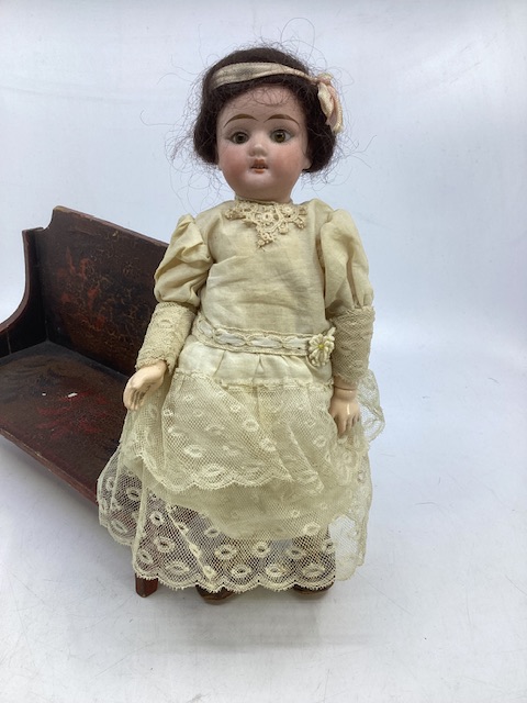 Antique German miniature 9” bisque head fully articulated doll with fixed glass eyes in antique