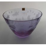 A Caithness pale amethyst glass "Circus" bowl with engraved decoration, etched signature C.B.