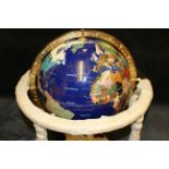 An Iccy co ltd specimen stone terrestrial table globe, gimbal mounted  on gilt metal stand, boxed