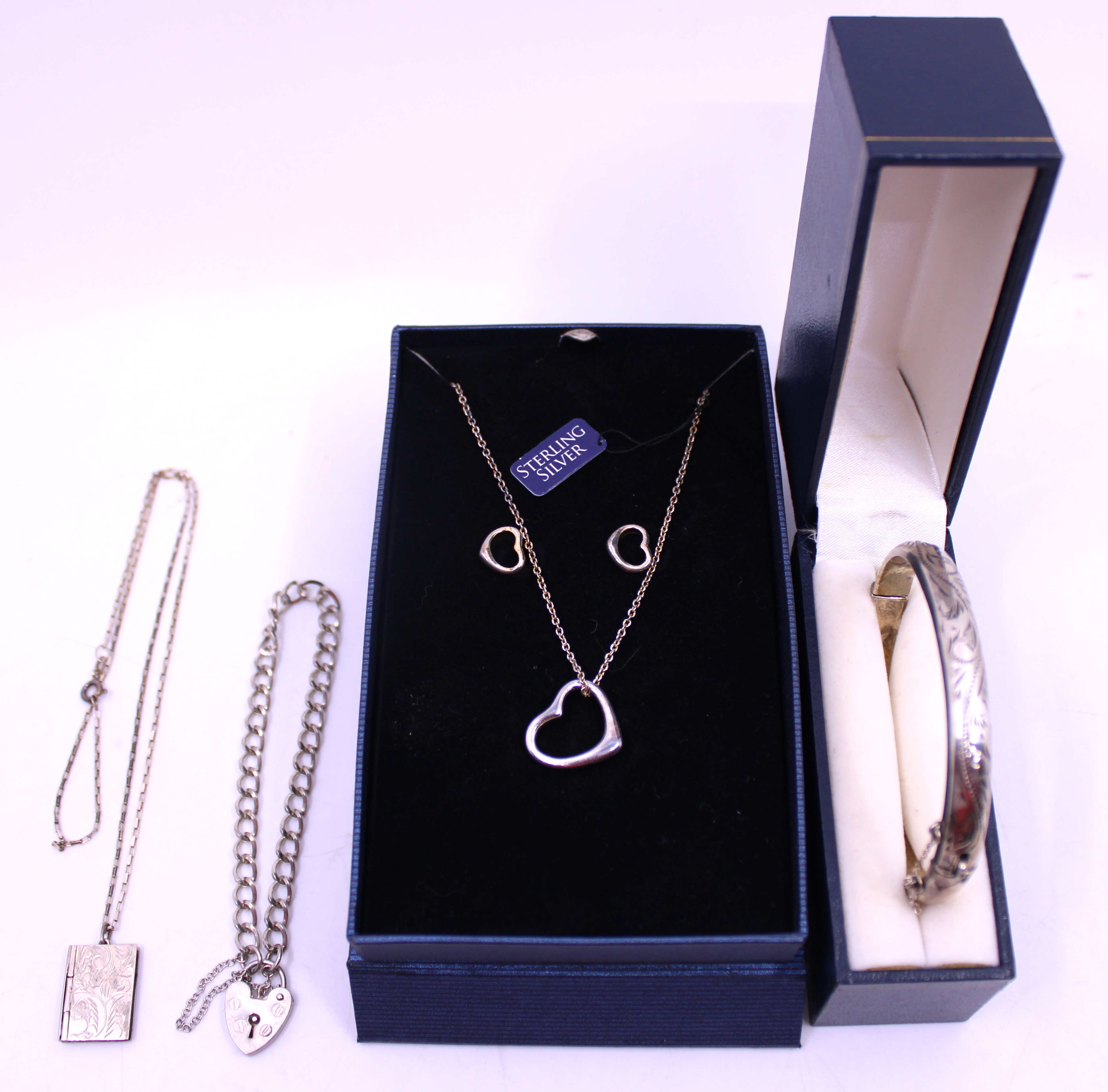 Selection of Sterling Silver Jewellery.  To include a Silver Hinged Bangle with Safety Chain. It has