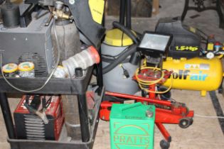 Large selection of garage items to include welders compressor shop vac and more.
