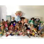 A large collection of collectible dolls to include a sally says talker with records, baby tears