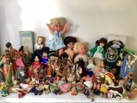 A large collection of collectible dolls to include a sally says talker with records, baby tears