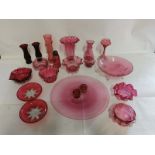 A collection of Victorian and later cranberry glass items, to include; vases, dishes, salts etc.  (
