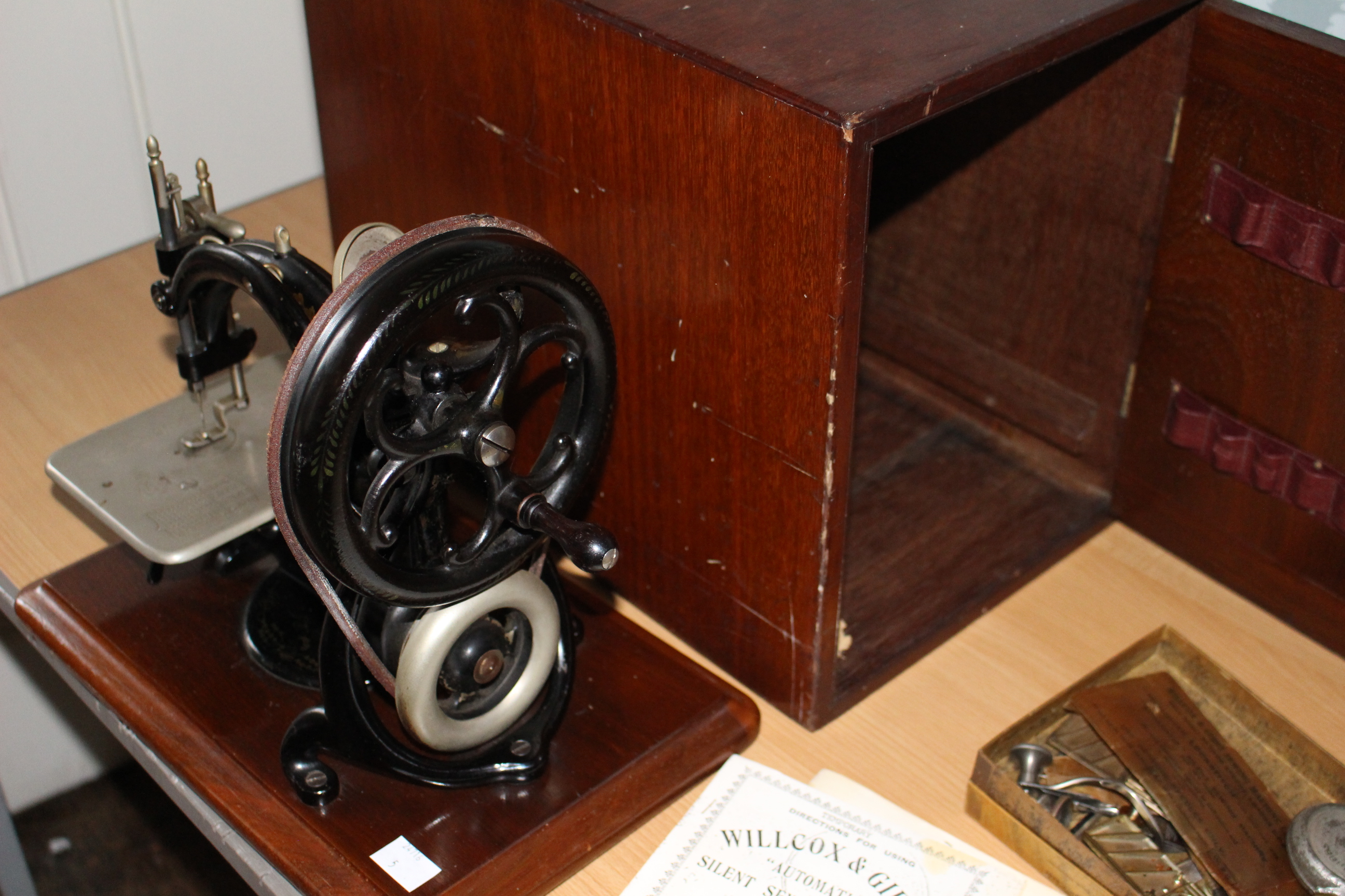A Willcox and Gibbs silent sewing machine, late 19th century with lockable box and instructions - Image 2 of 2