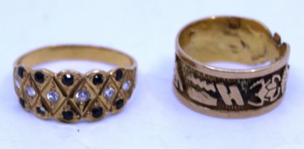 Two Unmarked Yellow Metal rings.  To include a unmarked yellow metal ring with Egyptian symbols