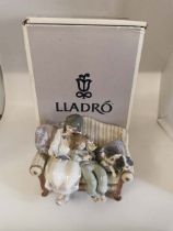 A Lladro porcelain figure 05735 Big Sister, 22cm long, in box. Figure is in good condition, box is