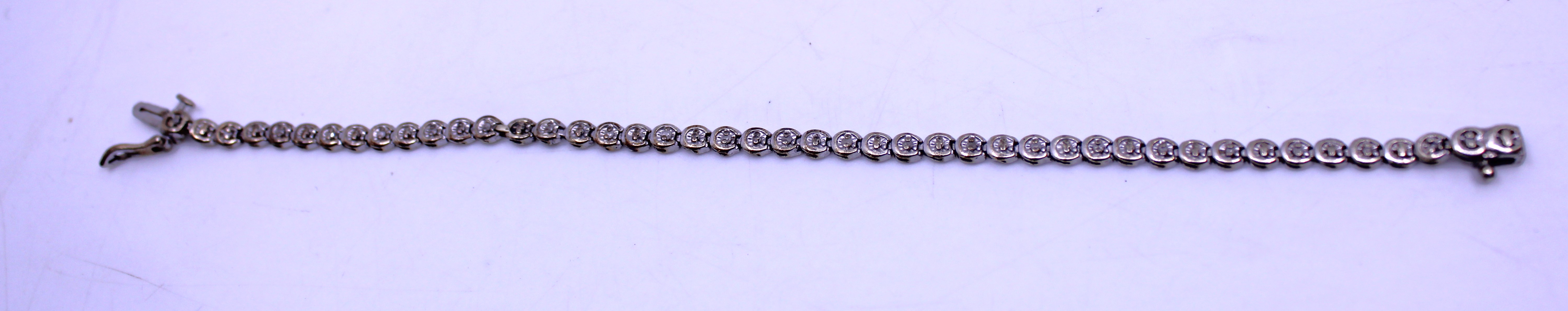 9ct White Gold 0.25ct total Diamond Bracelet.  The bracelet is hallmarked "375" for 9ct Gold and "