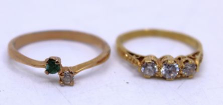 Two Gold Dress Rings. To include an 18ct Yellow Gold White Zircon Three-Stone Ring and a 10k