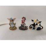 A porcelain Goebel cat figure together with two figures of fairies. (3)