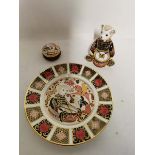 A Royal Crown Derby 'Drummer Bear' paperweight together with a trinket pot and dinner plate of the