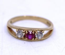 14ct Yellow Gold Synthetic Ruby and Cubic Zirconia Three-Stone Ring.  The ring contains a Round