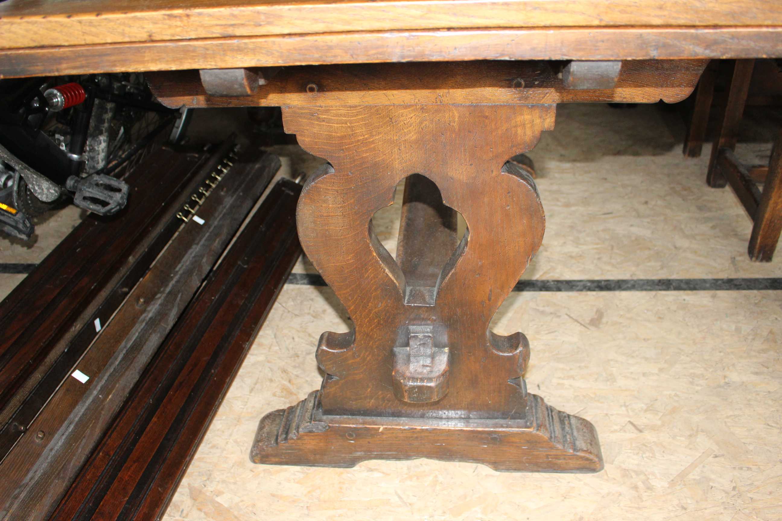 A 1930s oak dining room draw leaf table. Complete with 4 x leather seated chairs and 1 x arts and - Image 2 of 9