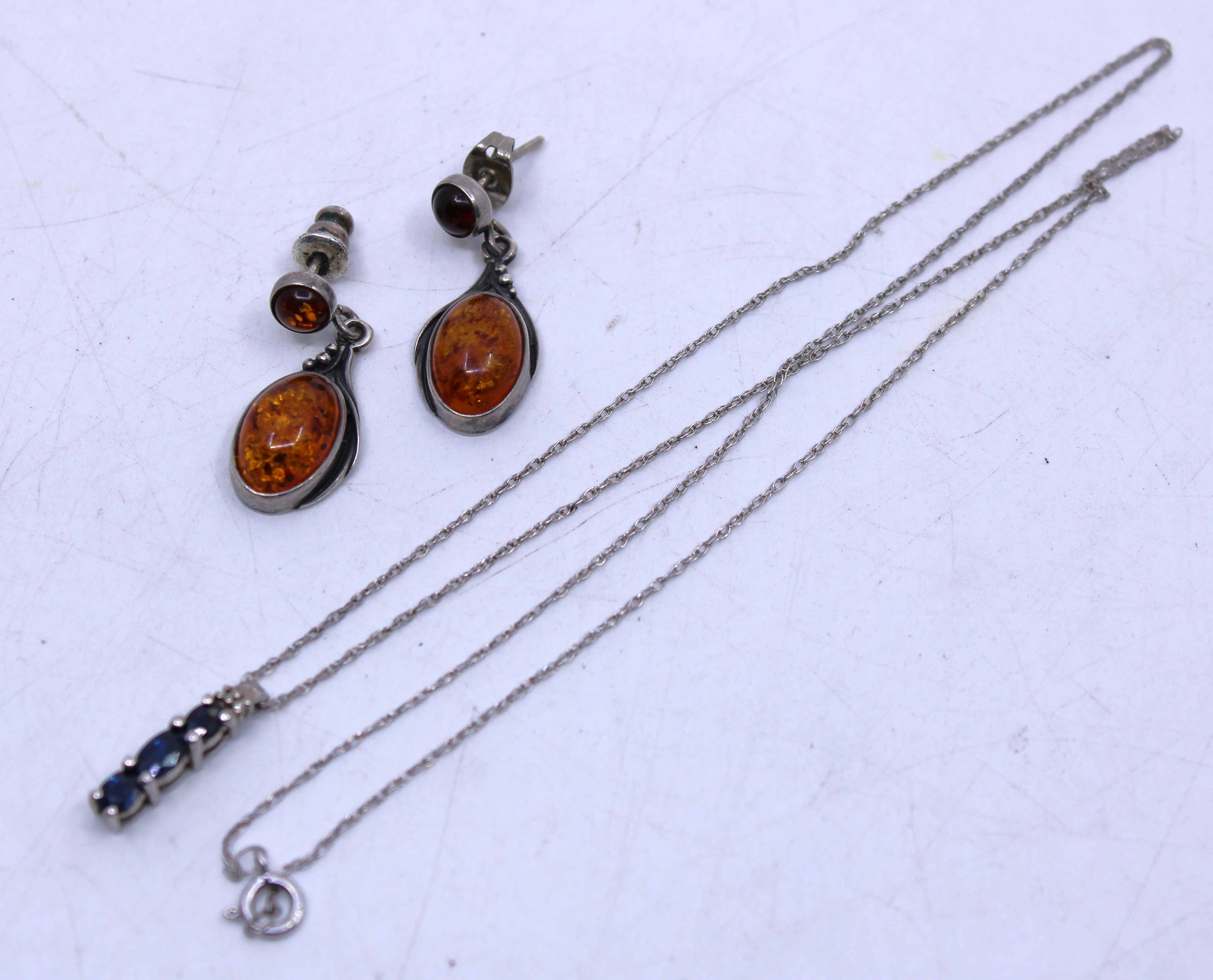 Selection of Sterling Silver Jewellery. To include a 925 Sterling Silver Three Stone Sapphire