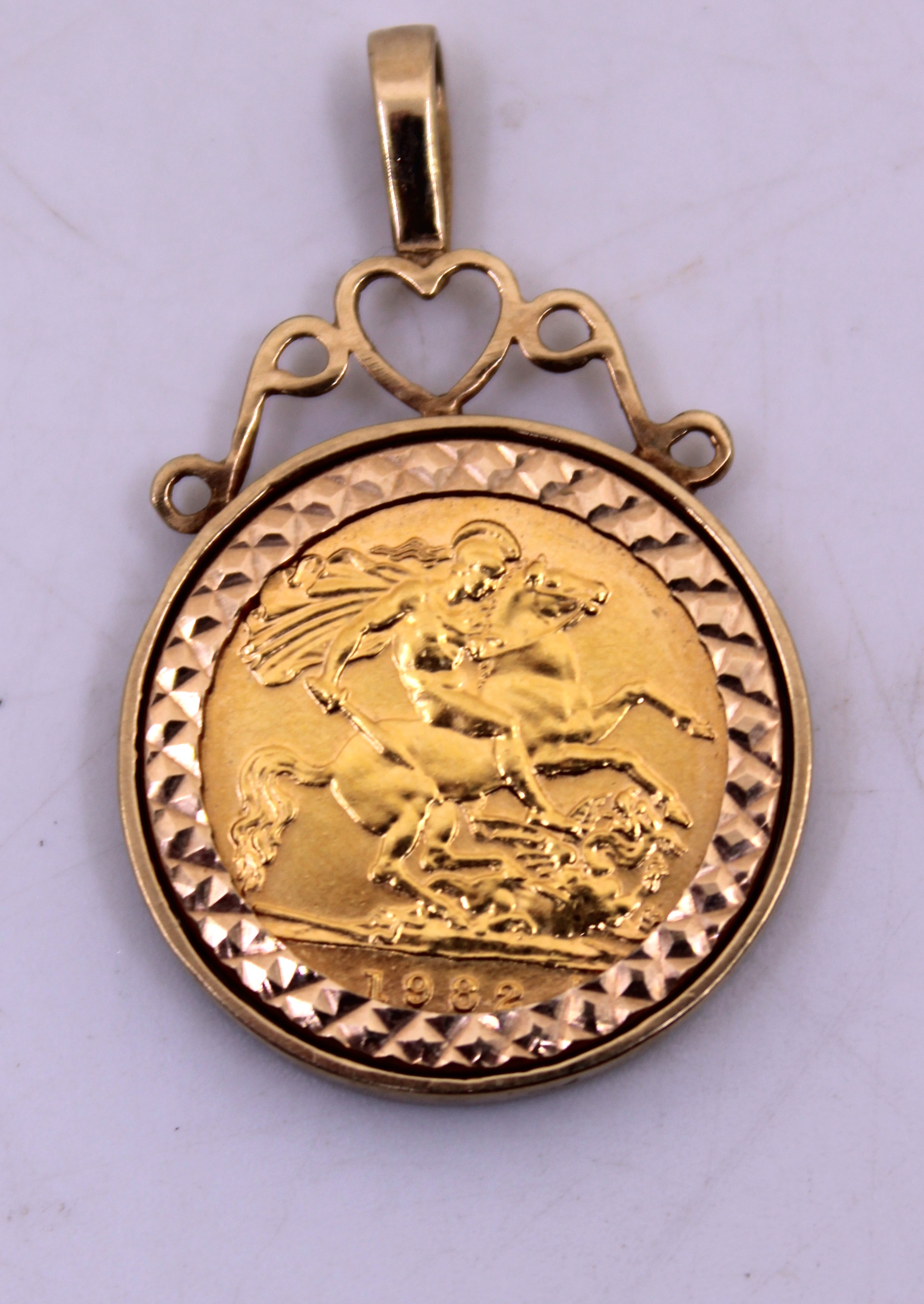 1982 Half Sovereign & Mount Pendant.  The pendant bale is hallmarked "375" for 9ct Gold.  The