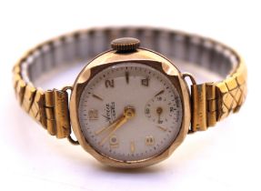 Vintage Ladies Unmarked Yellow Metal Avia 15 Jewels Watch with Gold Plated Stretchable Bracelet.