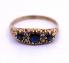9ct Yellow Gold Sapphire and Illusion Set Diamond Ring.  The Total Carat Weight of the Three Round