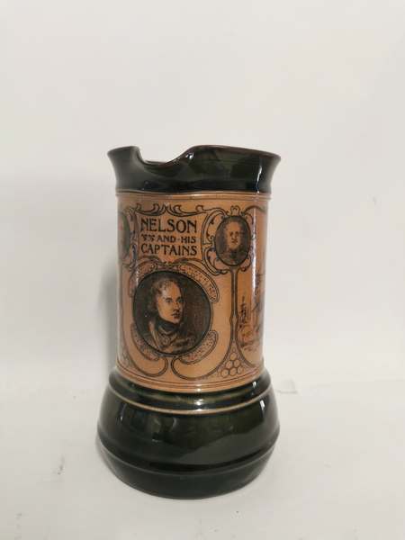 A Royal Doulton stoneware jug commemorating 'Nelson And His Captains' circa 1900. 21cm high. In good