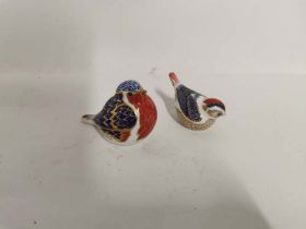 A Royal Crown Derby bone china Robin and another bird paperweights with gold stoppers. (2)