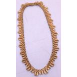 9ct Yellow Gold Necklace with adjustable safety fastening. There is bark effect pattern.  The