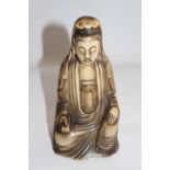 A Qing Dynasty Carved Soapstone figure of Guanyin.  Modelled seated in 'royal ease' with a serene