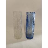 A pair of Ravenhead (Whitefriars style) bark glass vases, one clear and one blue, each 16.5cm