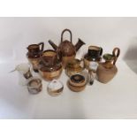 A selection of Royal Doulton and Lambeth stoneware jugs to include an Egyptian style jug, 'The Old